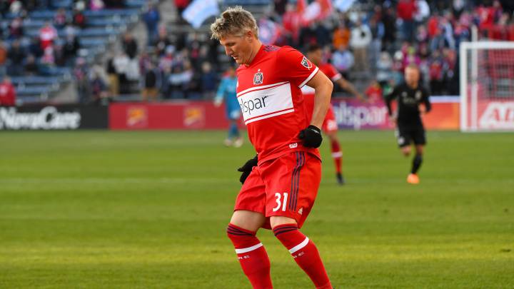 Chicago Fire midfielder Bastian Schweinsteiger kicks the ball down field against Sporting Kansas City