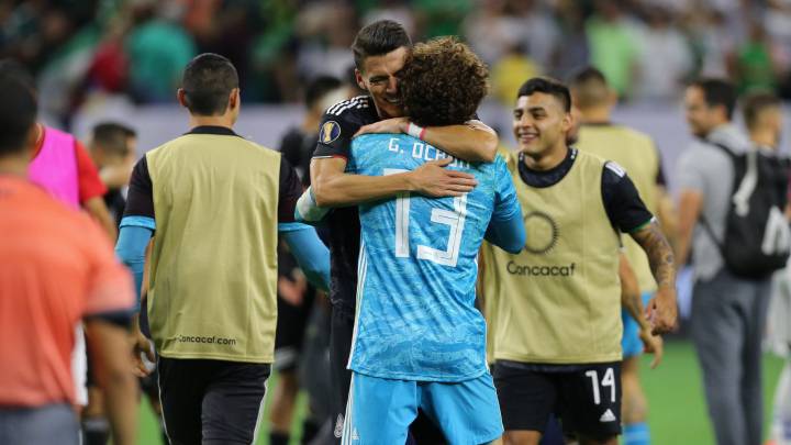 Memo Ochoa and Hector Moreno celebrate reaching semifinals after penalties