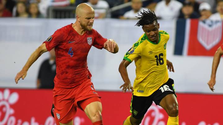 Jamaica forward Peter Vassell works against United States midfielder Michael Bradley during the first half in semi-final play in the CONCACAF Gold Cup