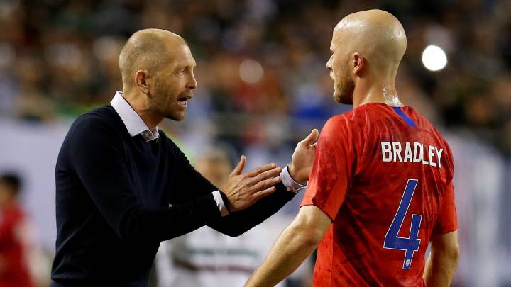 Head coach Gregg Berhalter of the United States speaks with Michael Bradley in the first half against Mexico during the 2019 CONCACAF Gold Cup Final