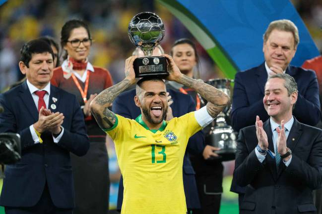 Serial champion | Brazil's Dani Alves celebrates winning best player of the 2019 Copa America.