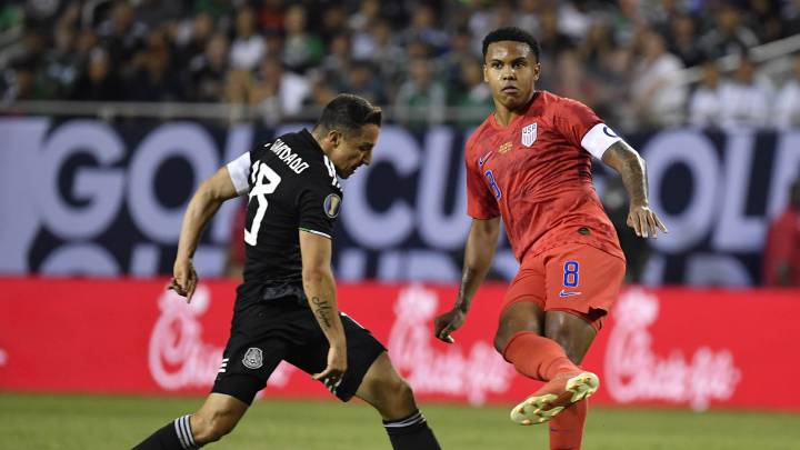 Weston Mckennie passes the ball away from Mexico midfielder Andres Guardado during the second half in the championship match of the CONCACAF Gold Cup