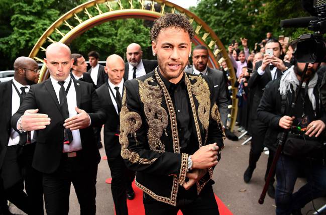 Red carpet treatment | Paris Saint-Germain's Brazilian forward Neymar arrives for a TV show on May 13, 2018 in Paris.