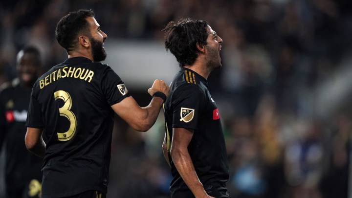 Carlos Vela celebrates with defender Steven Beitashour after scoring a goal in the first half after the game at Banc of California Stadium.