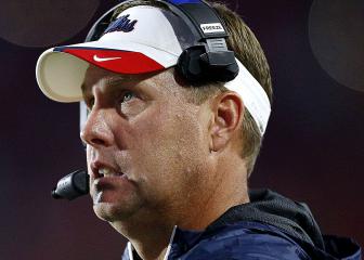 Football first: coach calls plays from his hospital bed