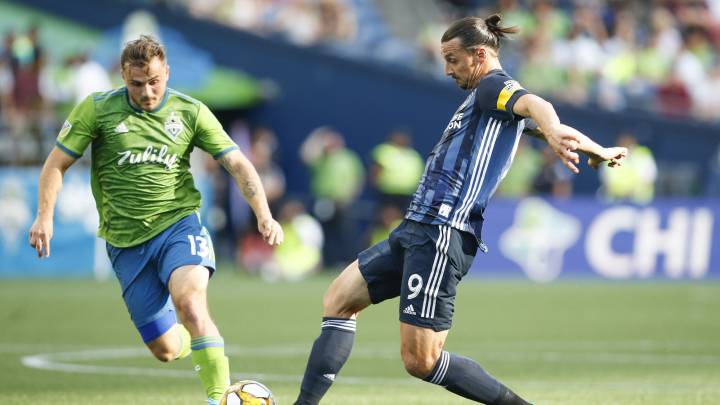 Zlatan Ibrahimovic passes the ball in front of Seattle Sounders FC midfielder Jordan Morris during the second half at CenturyLink Field.