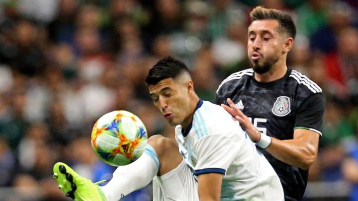 Ezequiel Palacios #29 of Argentina and Hector Hererra #16 of Mexico compete for the ball during the International Friendly soccer match at the Alamodome