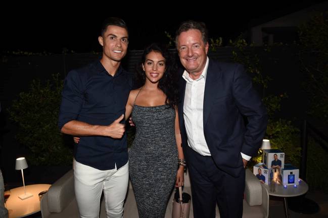 Taking the Piers | Cristiano Ronaldo, Georgina Rodriguez and Piers Morgan celebrate the launch of new CR7 Play It Cool.