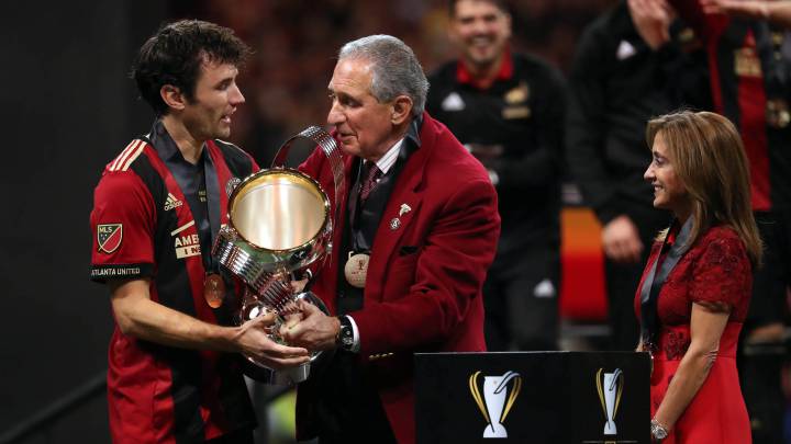 Atlanta United owner Arthur Blank hugs defender Michael Parkhurst after defeating the Portland Timbers in the 2018 MLS Cup championship game at Mercedes-Benz Stadium.