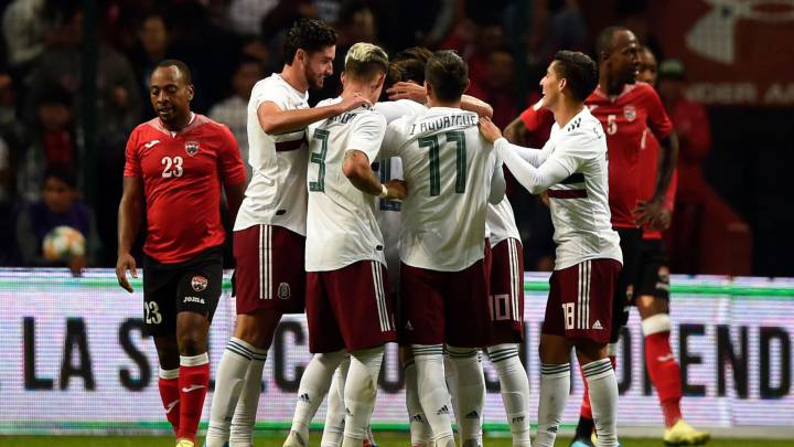 Mexico's player celebrate their second goal against Trinidad and Tobago during their friendly match at the Nemesio Dies Stadium in Toluca, Mexico
