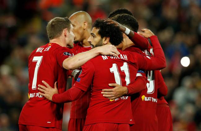 Liverpool's Mohamed Salah celebrates scoring their fourth goal against RB Salzburg.