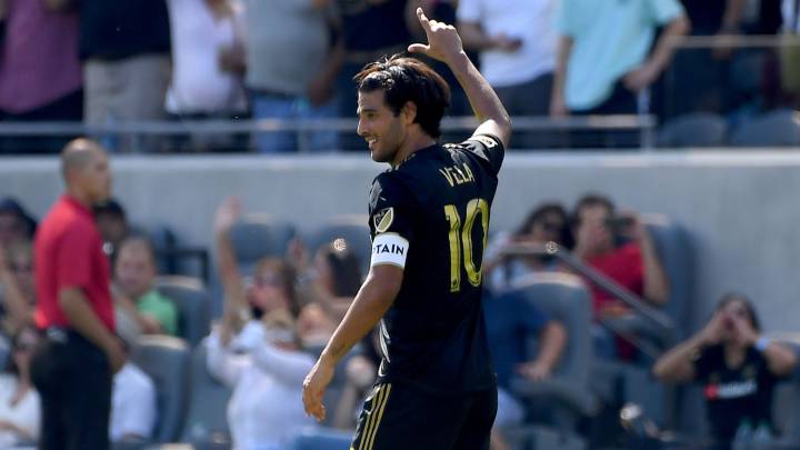 Carlos Vela celebrates after breaking the MLS single-season scoring record
