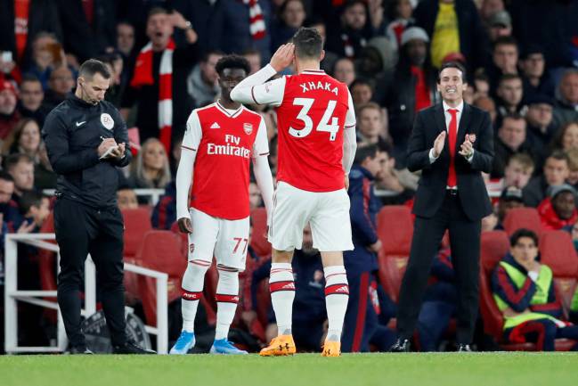 Arsenal's Granit Xhaka gestures to fans as he is substituted.