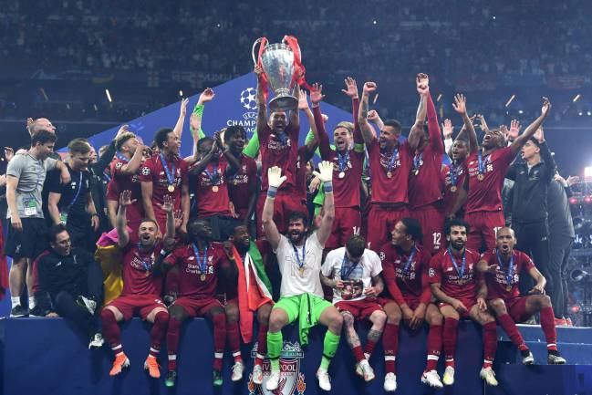 Liverpool players celebrate with the European Champion Clubs' Cup.