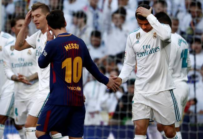Players of the decade | Cristiano Ronaldo of Real Madrid shakes hands with Barcelona's Lionel Messi during El Clásico 2017.