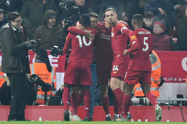 A Red Machine | Liverpool players celebrate.