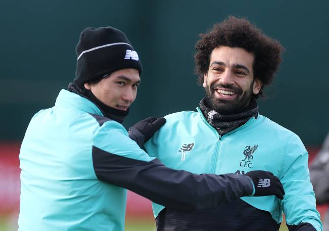 Ready | Liverpool's Mohamed Salah with Takumi Minamino during training.