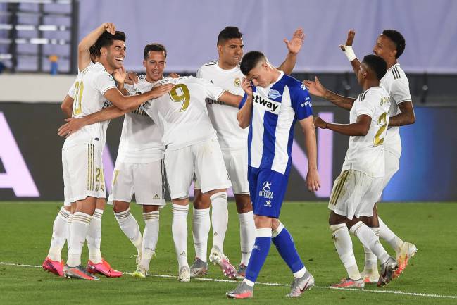 No James in sight | Marco Asensio of Real Madrid celebrates with teammates.