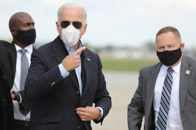 Democratic presidential nominee and former Vice President Joe Biden speaks briefly with journalists before traveling to Grand Rapids, Michigan, at New Castle County Airport October 2, 2020 in New Castle, Delaware. Biden said he tested negative twice Friday for the coronavirus after it was reported that U.S. President Donald Trump and first lady Melania Trump tested positive for COVID-19.