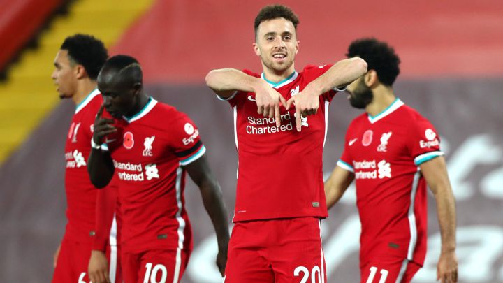 Late Jota strike helps Liverpool go top