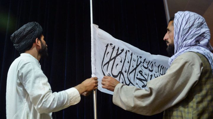 What does the Taliban flag say in English?