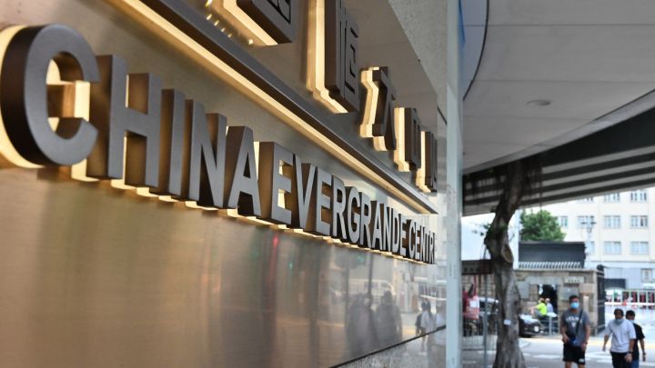 How does Evergrande conglomerate put China's housing system in danger of collapse?
