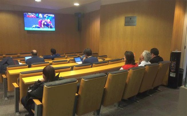 Filipe Luis watches second half from Camp Nou press room