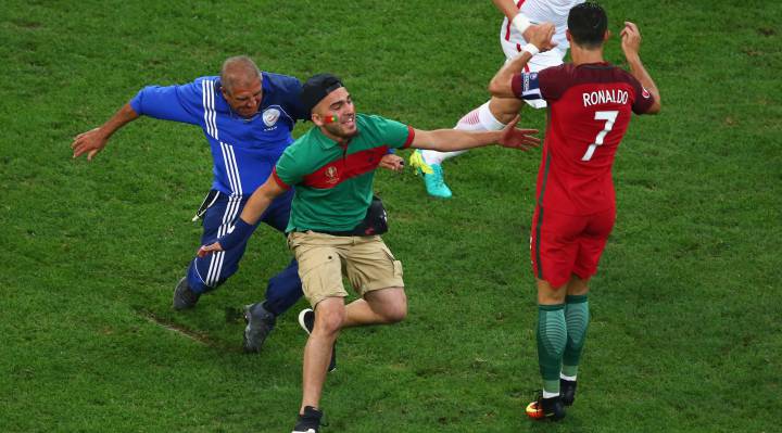 Pitch invader at Portugal match tries to hug Cristiano Ronaldo