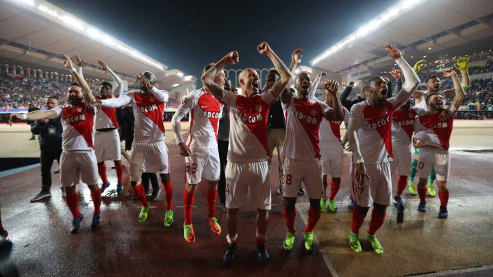 Monaco's players celebrate at the end of the UEFA Champions League round of 16 football match between Monaco and Manchester City at the Stade Louis II in Monaco on March 15, 2017.