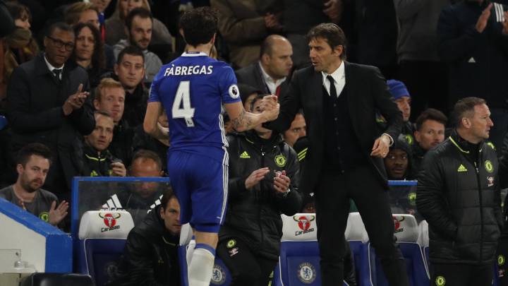 Chelsea's Cesc Fabregas is congratulated by manager Antonio Conte as he is substituted.
