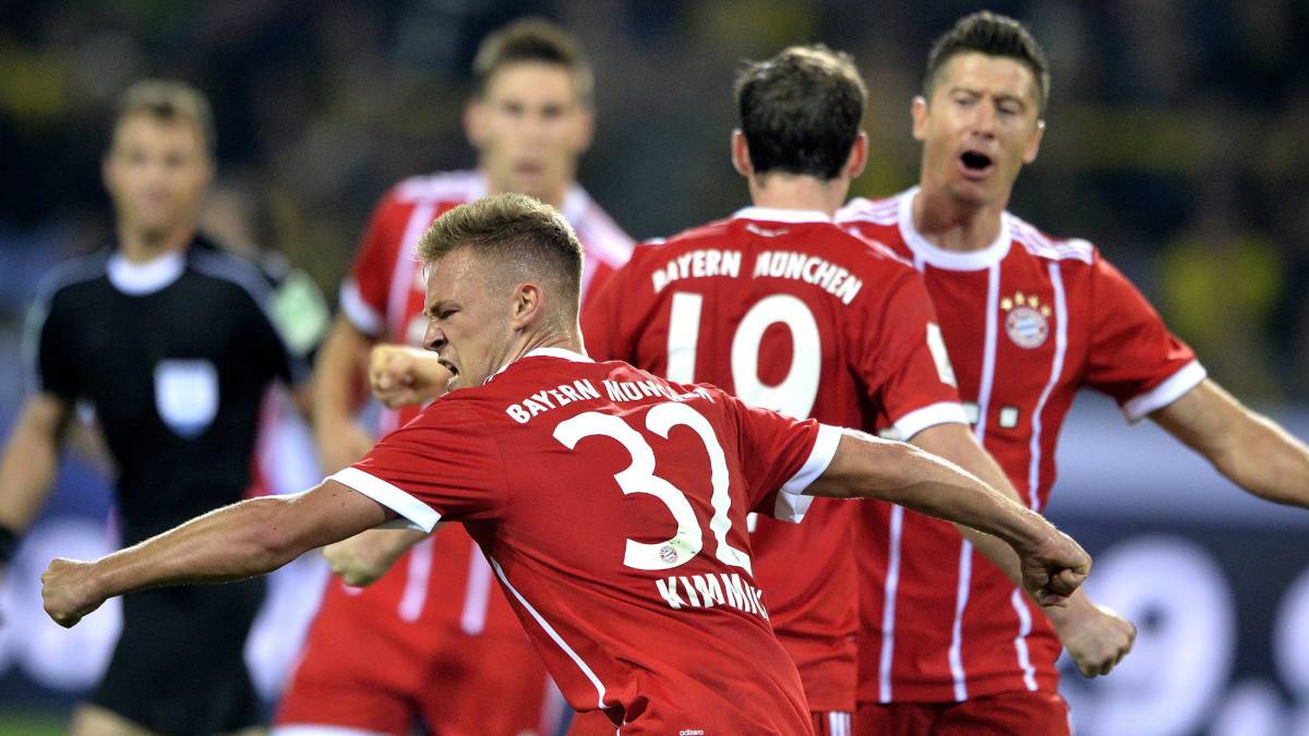 Bayern's Joshua Kimmich (front) celebrates the 2-2 equalizer during the German Supercup soccer match between Borussia Dortmund and FC Bayern Munich in Dortmund, Germany, 05 August 2017.