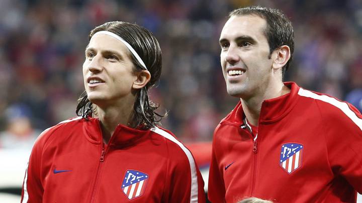 Filipe Luis y Godín, antes de un partido de Champions la temporada 2017-2018..
