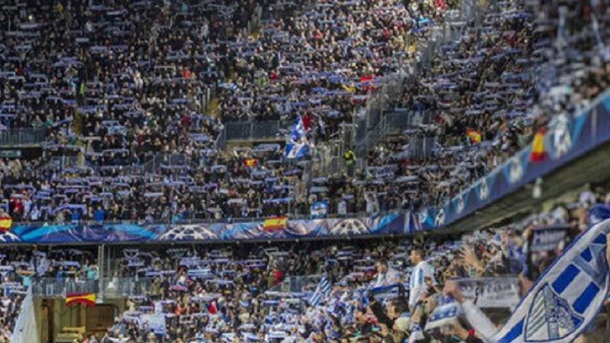 La afición del Málaga en La Rosaleda, durante un partido.