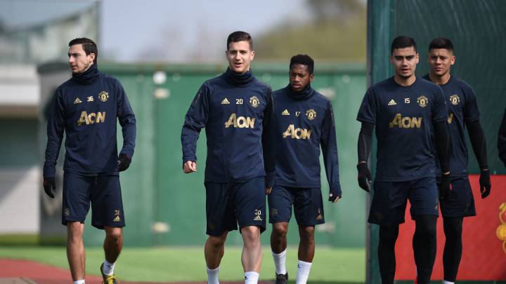 Matteo Darmian, con Andreas Pereira.