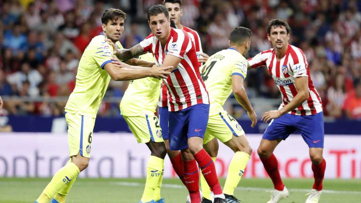 Giménez y Savic en el Atlético-Getafe.