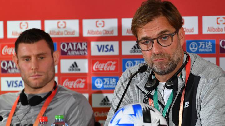Jurgen Klopp y James Milner.