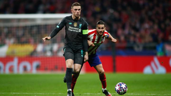 Jordan Henderson of Liverpool and Jorge Resurreccion "Koke" of Atletico Madrid in action during the UEFA Champions League football match, round of 16, played between Atletico de Madrid and Liverpool FC at Wanda Metropolitano stadium on February 18, 2020, in Madrid, Spain.
