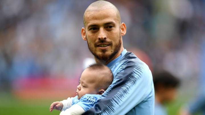 David Silva, con su hijo en un partido del Manchester City.