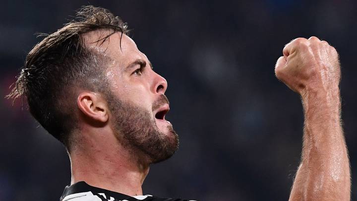 Juventus' Bosnian midfielder Miralem Pjanic celebrates after scoring during the Italian Serie A football match Juventus vs Bologna on October 19, 2019 at the Juventus stadium in Turin. (Photo by Marco Bertorello / AFP)