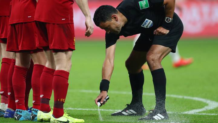 Soccer Football - Club World Cup - Semi Final - Monterrey v Liverpool - Khalifa International Stadium, Doha, Qatar - December 18, 2019 Referee Roberto Tobar uses spray before a free kick REUTERS/Ibraheem Al Omari