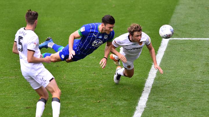 WIGAN, ENGLAND - JULY 14: Kieffer Moore of Wigan Athletic scores his team's fourth goal during the Sky Bet Championship match between Wigan Athletic and Hull City at DW Stadium on July 14, 2020 in Wigan, England. (Photo by Nathan Stirk/Getty Images) *** BESTPIX ***