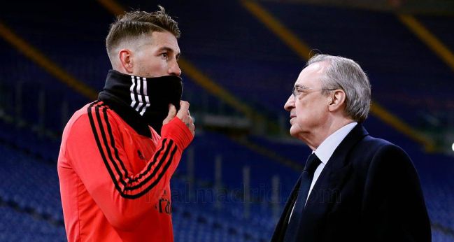 Sergio Ramos and Florentino Pérez chat before Madrid's game against AS Roma in 2018.