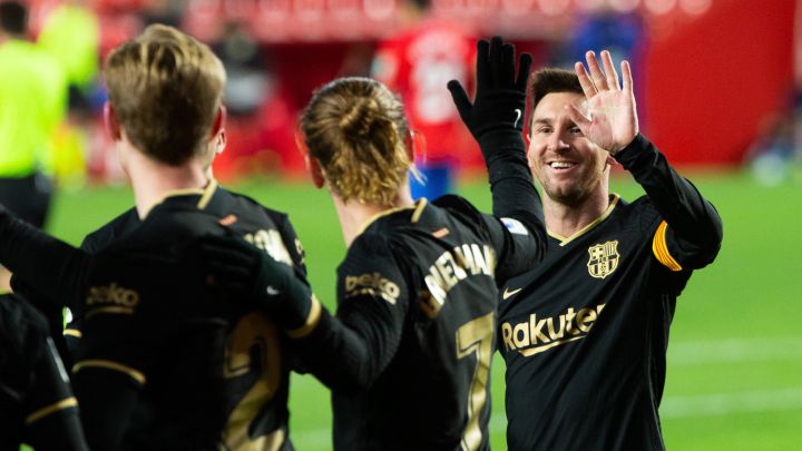 Celebrate score of Antoine Griezmann of Barcelona with Lionel Messi of Barcelona during the spanish league, LaLiga, football match played between Granada Club de Futbol and Futbol Club Barcelona at Nuevos Los Carmenes Stadium on January 9, 2021 in Granada, Spain. AFP7