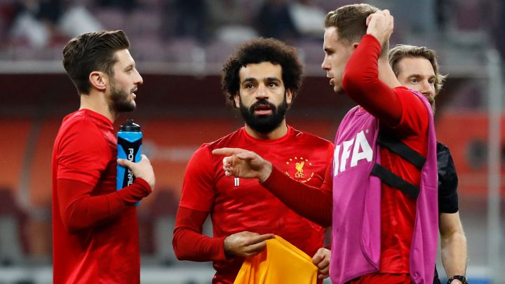 Soccer Football - Club World Cup - Semi Final - Monterrey v Liverpool - Khalifa International Stadium, Doha, Qatar - December 18, 2019 Liverpool's Adam Lallana , Mohamed Salah and Jordan Henderson during the warm up before the match REUTERS/Corinna Kern