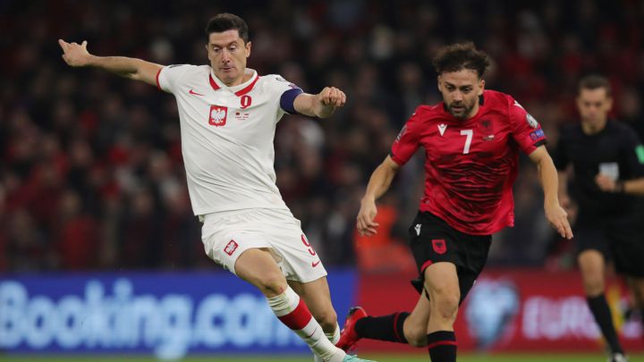 Robert Lewandowski in action with Albania's Keidi Bare