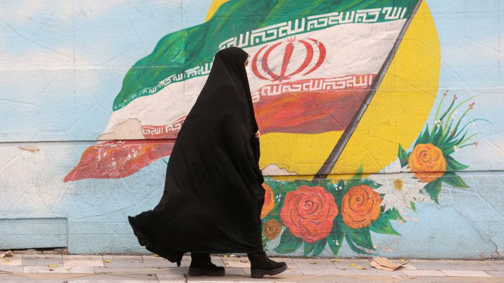 Women walk after morality police shut down in Tehran