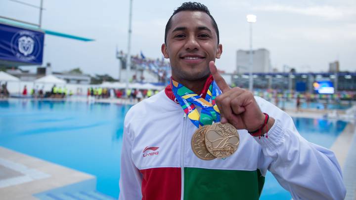 Jahir Ocampo durante la competencia final de clavados 3m sincronizados varonil desde el Complejo Acuatico en Barraqnuilla.