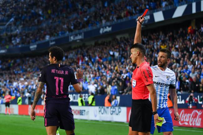 Neymar Jr. of Barcelona is shown a red card during the La Liga match between Malaga CF and FC Barcelona at La Rosaleda