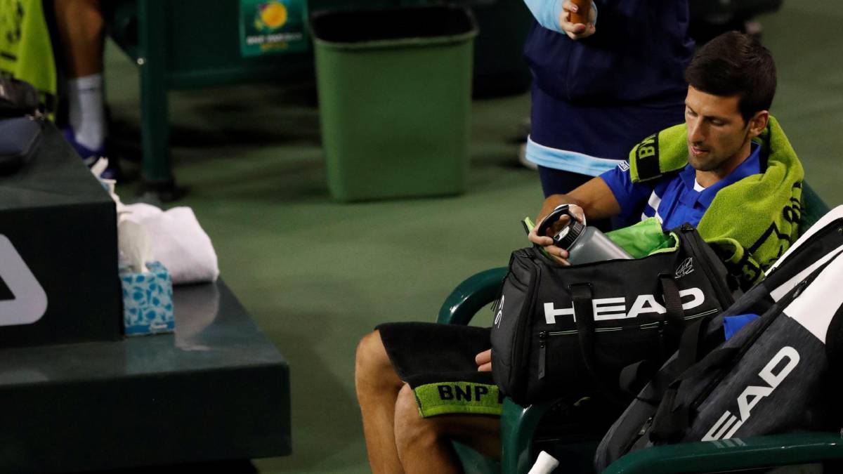 El tenista alemán Philipp Kohlschreiber (izq) y el serbio Novak Djokovic (dcha)