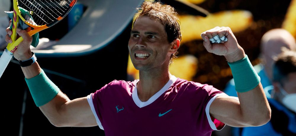 Spain\'s Rafael Nadal celebrates after winning the match against Marcos Giron of the US during their men\'s singles match on day one of the Australian Open tennis tournament in Melbourne on January 17, 2022. (Photo by Brandon MALONE / AFP) / -- IMAGE RESTRICTED TO EDITORIAL USE - STRICTLY NO COMMERCIAL USE --